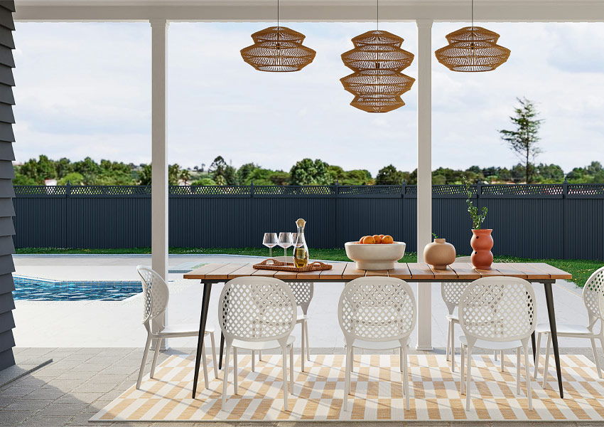 outdoor dining table by pool Photo by Spacejoy on Unsplash