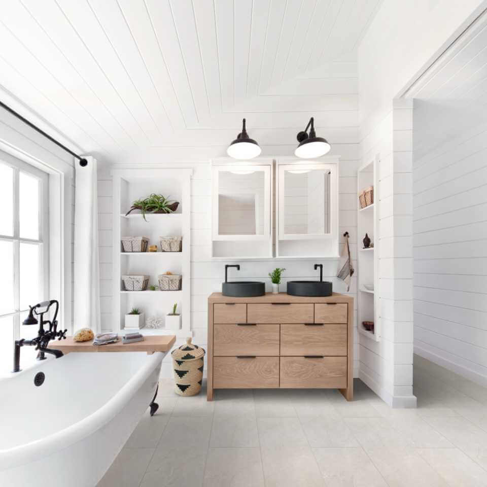 A bathroom tile with a tub and sink